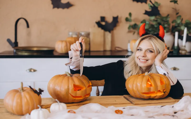 at home photoshoot with pumpkin heads and candles