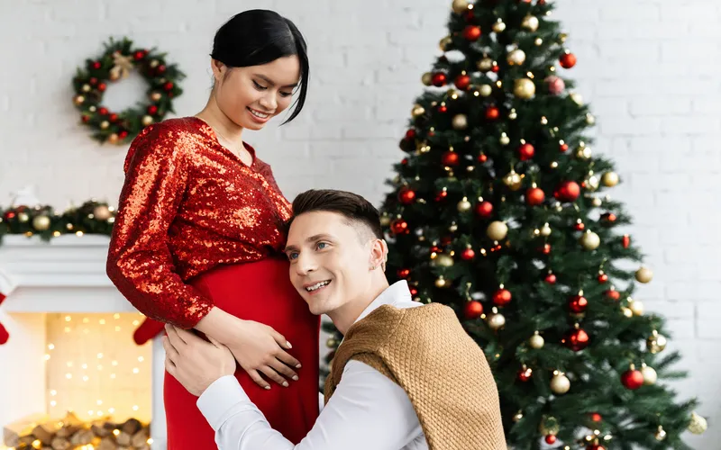 expecting couple celebrating christmas