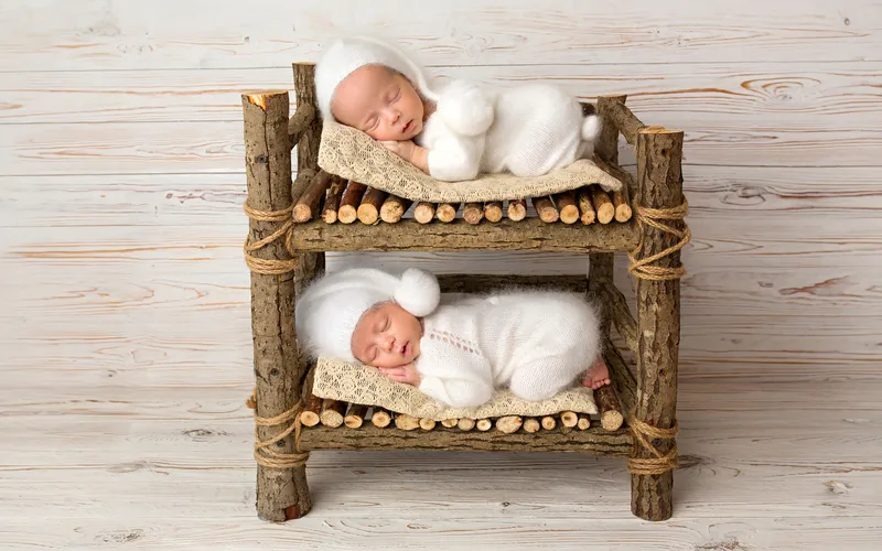 cute twins sleeping on bunk beds