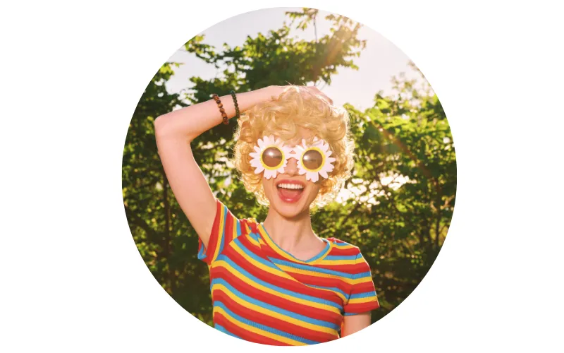 profile photo of a woman in stripped shirt and flower glasses