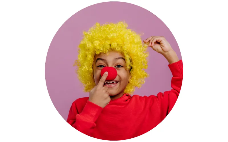 portrait of a little boy in clown costume