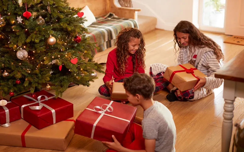 Children opening their presents on a Christmas morning