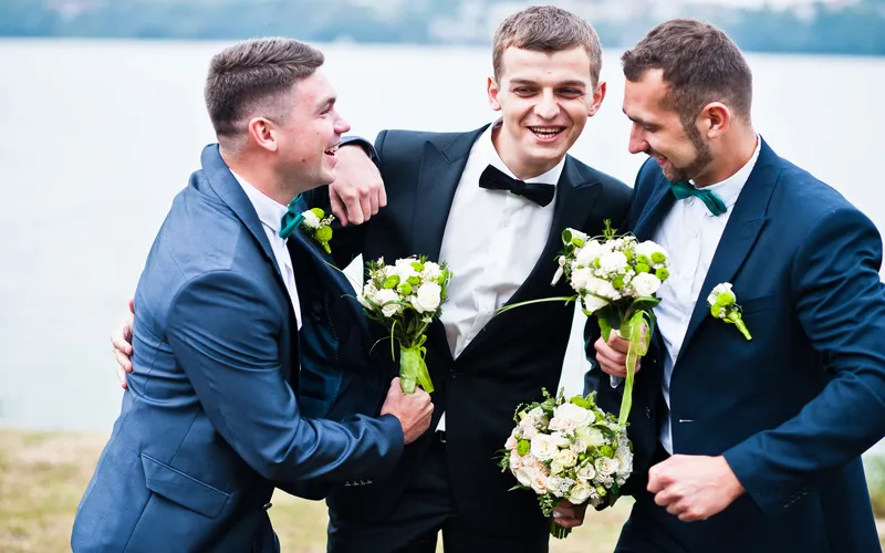 groom and the groomsmen laughing together