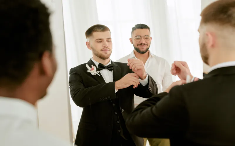 behind the scenes of wedding with groom and groomsmen