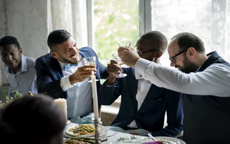 groomsmen toasting their drinks