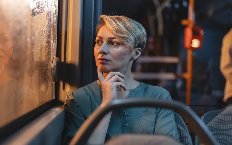 candid shot of woman travelling in public transport