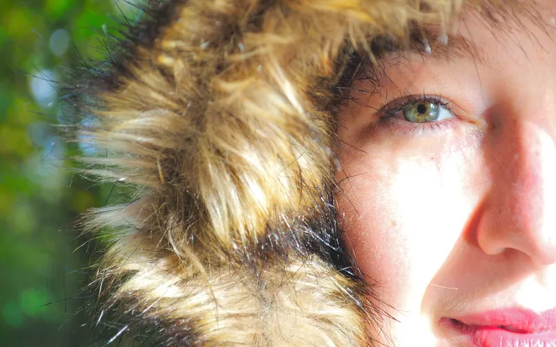 Closeup portrait of a girl wearing a furry hoodie
