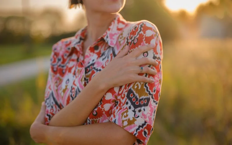 hand on opposite shoulder pose