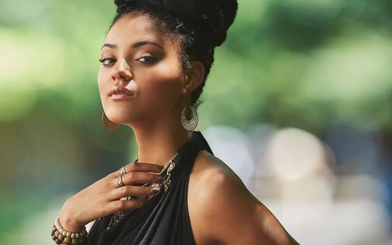 hand touching neck pose