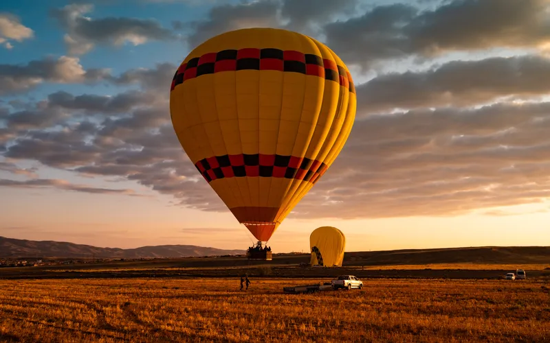 photo of hot air balloon taken during sunset