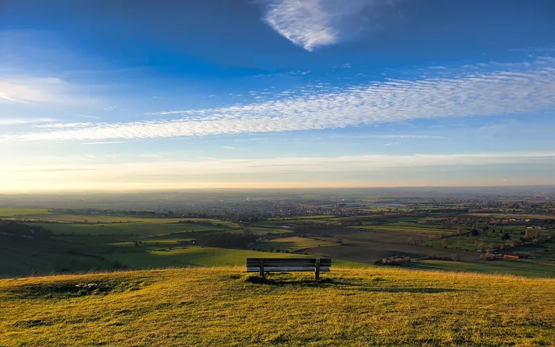 photo of a bench against a beautiful backdrop