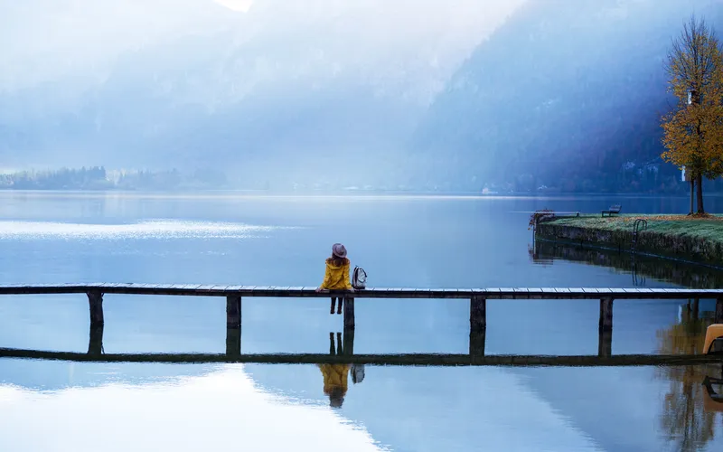a tourist sitting on the bridge