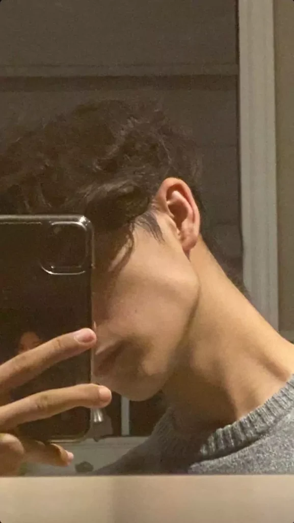 A flattering cute selfie pose that accentuates your features, perfect for showcasing your jawline in style.