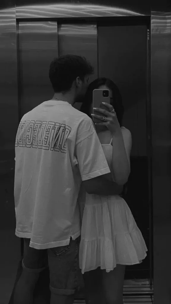 A romantic and stylish cute selfie pose that captures the bond between two people, reflected perfectly in the mirror.