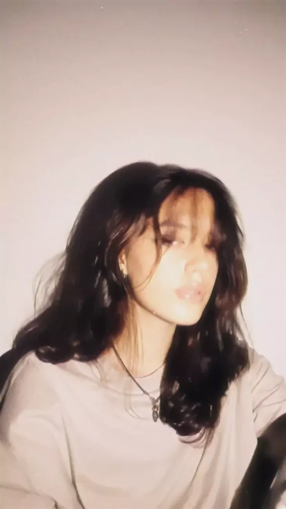 A stylish cute selfie pose that keeps the focus on you while creating a dreamy, aesthetic effect.