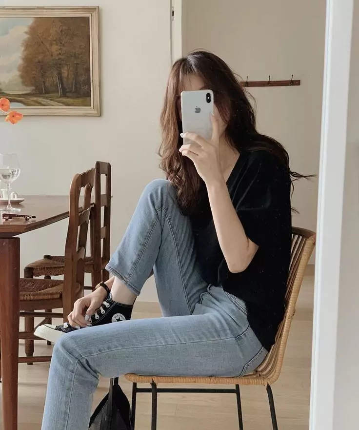 One of the top selfie poses for girls, showcasing confidence and comfort in a natural setting.