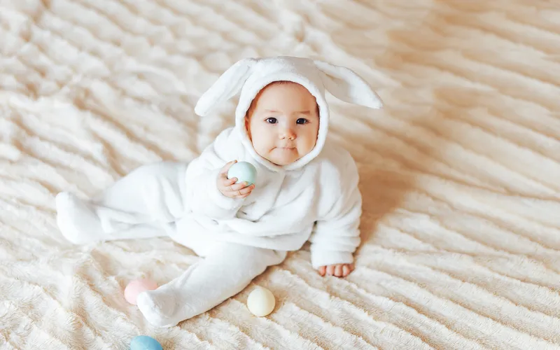cute baby in pastel colored outfit