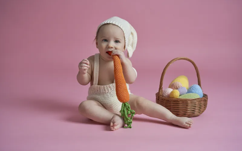 easter infant photo ideas for a baby munching on a carrot