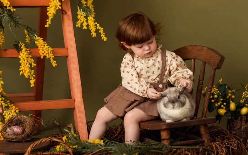 baby playing with a real bunny