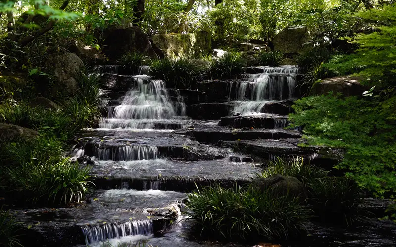Waterfall flowing over rocks with a soft, milky look from an 8 second long exposure