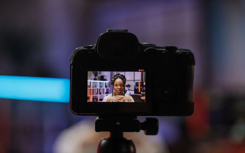 woman in the screen of a camera