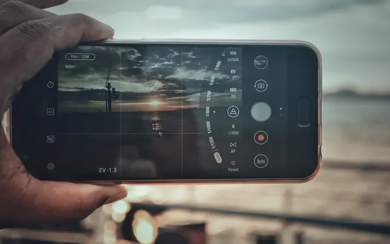 capturing sunset with phone's camera to depict rule of thirds