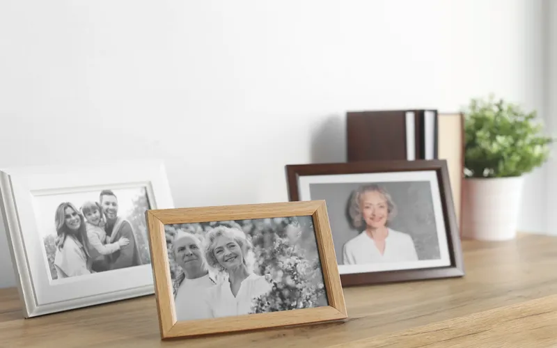 photo frames of family displayed on table
