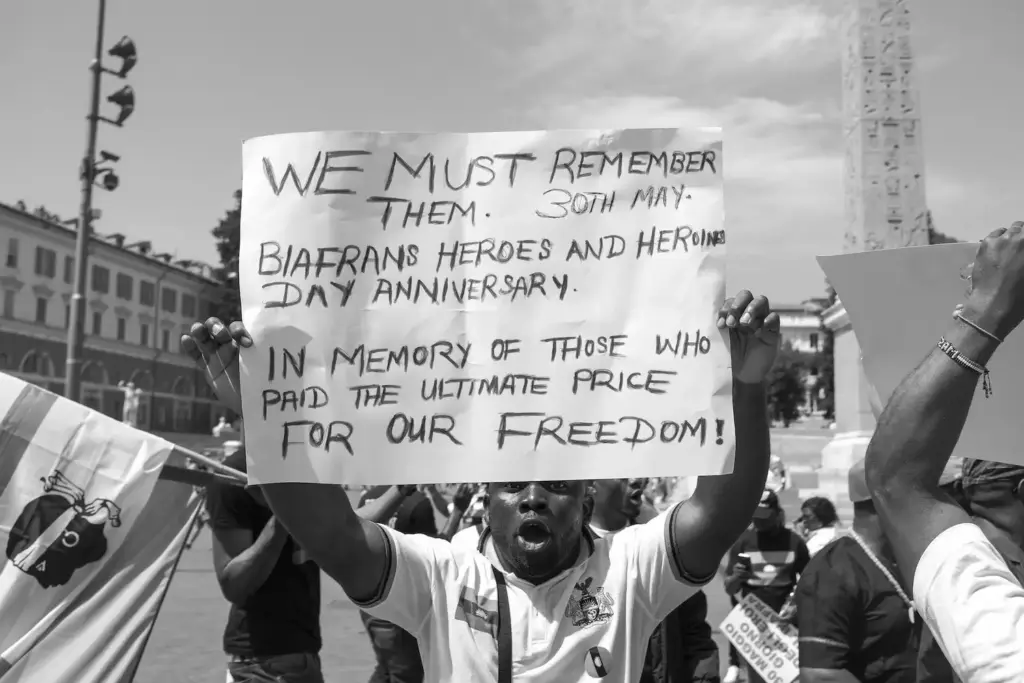 Street photography of protesting by alex coghe, black and white street photography, learn to capture the streets