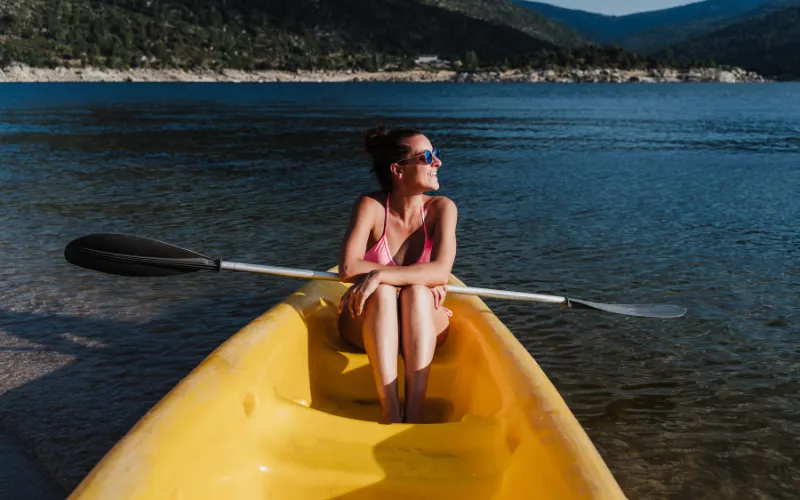 Summer adventure photoshoot with kayaking and jet skiing on open water
