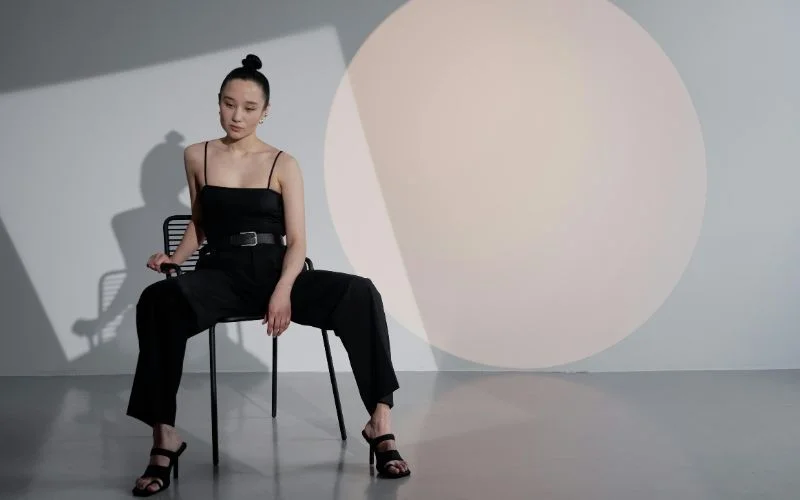 sitting on chair pose for female fashion photography
