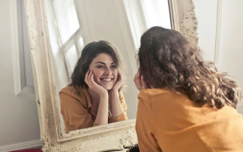 practice in the mirror for the perfect smile in photo