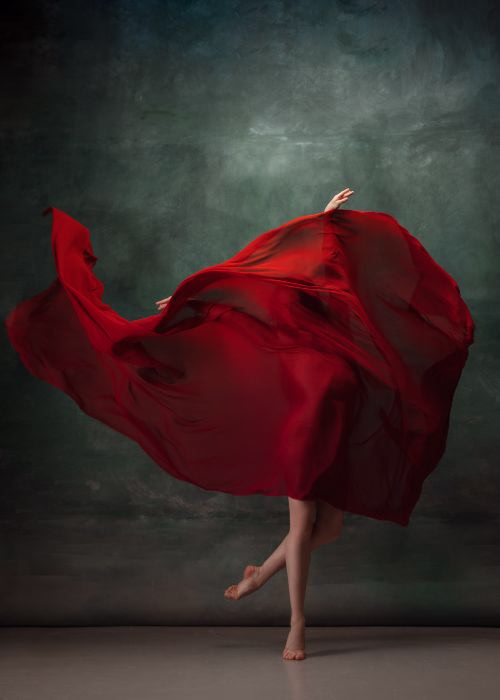 Fine art photography featuring a dancer wrapped in flowing red fabric, illustrating the creative vision that remains essential despite advances in AI in photography.