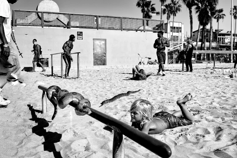 Child playing on the beach captured with candid street photography techniques.