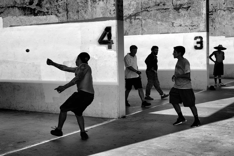People playing sports in an urban setting photographed during a street photography session.