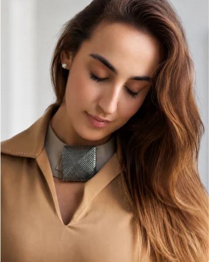 Enhance fashion images with AI photo retouching and realistic texture control.