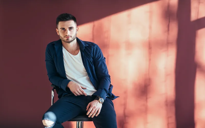 Attractive man posing in casual fashion clothing