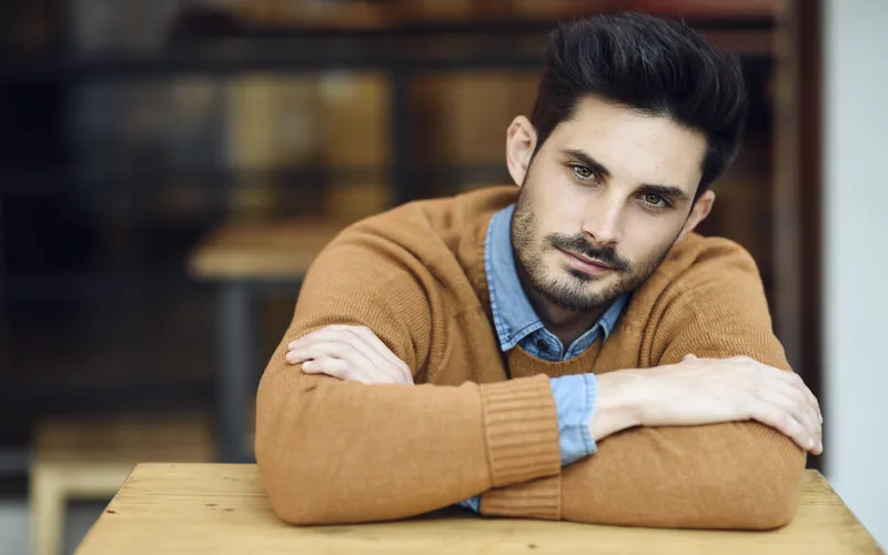 portrait of a man posing while tilting his head