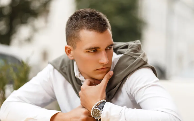 young handsome man posing while looking away from camera