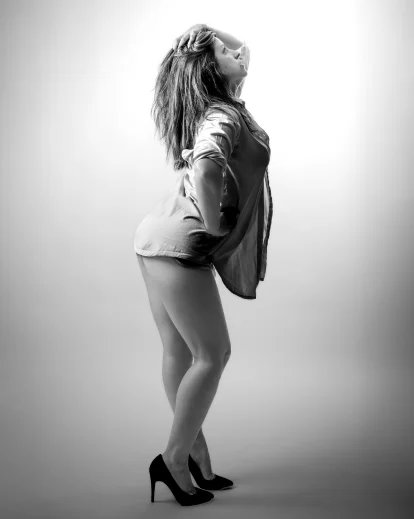 Boudoir model photography demonstrating flattering poses that create natural body lines and elegant compositions.
