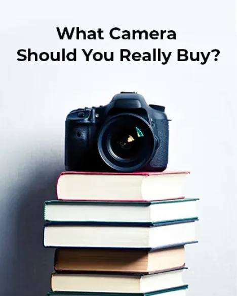 image of a camera placed over a pile of books