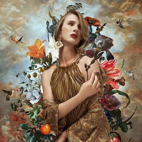 a model posing with flowering arrangement